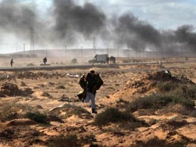 قوات القذافي تتقدم باتجاه مدينة "راس لانوف" النفطية بمساندة طائرات حربية