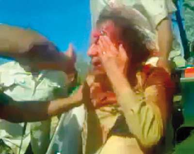 مدير أمن القذافي:القائد لم يقاتل وكان يفضل الموت في ليبيا على المحاكمة والثوار عذبوه ساعتين قبل قتله