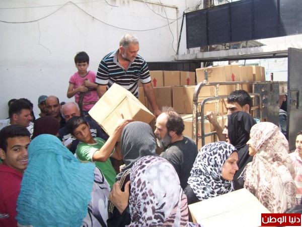 الاتحاد العام للمرأة الفلسطينيه يوزع مساعدات للمهجرين الفلسطينين من سوريا