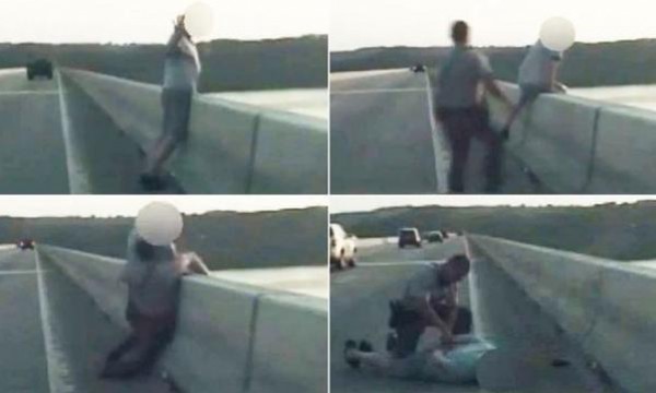 فيديو مذهل.. شرطي أمريكي ينجح في إنقاذ منتحر حاول القفز من جسر ارتفاعه 90 قدماً