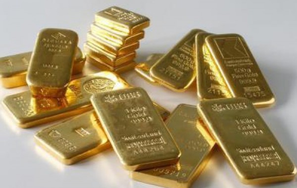الذهب ينخفض بعد تلميح المركزي الأمريكي لرفع الفائدة في 2015