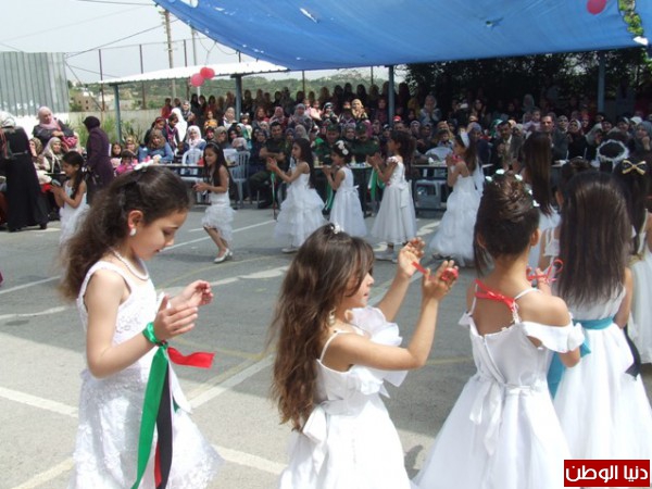 قوات الأمن الوطني الفلسطيني تشارك في حضور حفل اليوم المفتوح وتكريم الطلبة الأوائل الذي أقامته مدرسة بنات الطيبة