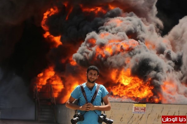 صحفي من غزة يفوز بجائزة لقب مصور عام 2015 في الشارقة