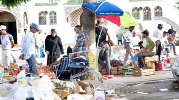 باعة يطالبون بالتحقيق في إحراق امرأة نفسها احتجاجا على حجز السلطات لبضاعتها
