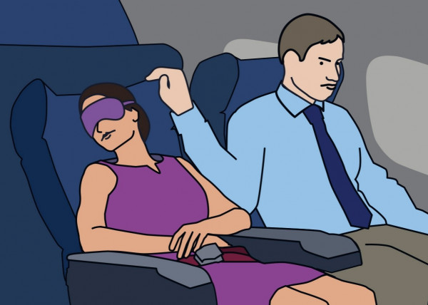 هندي يهتك عرض امرأة جالسة في الطائرة قربه وزوجته بجانبه