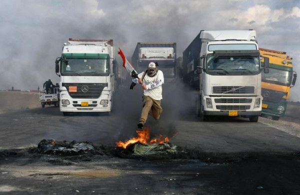 كورونا يُعلّق الاحتجاجات في ساحة التحرير بالعراق