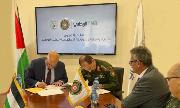 البنك الوطني واللجنة العلمية التابعة للأمن الوطني يوقعان اتفاقية تعاون