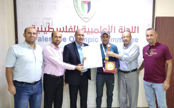المكتب التنفيذي للجنة الأولمبية يكرم تمراز وبطل الترايثلون عطا الله